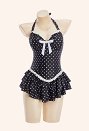 Traje de baño de una pieza estilo vintage con lunares negros cuello halter y falda con volantes