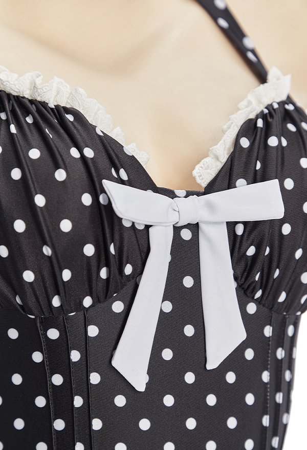 Traje de baño de una pieza estilo vintage con lunares negros cuello halter y falda con volantes Traje de baño de una pieza estilo vintage con lunares negros cuello halter y falda con volantes